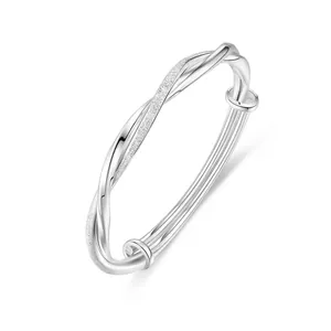 Polished silver Mobius twist bangle with adjustable sliding closure for women
