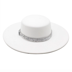 Detail of white wool boater hat featuring a shimmering rhinestone band decoration