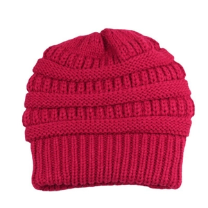 Detailed close-up showing the magenta coarse knit texture of the winter beanie hat