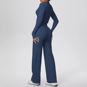 Deep blue women's yoga set featuring high-waisted wide leg pants and a slim fit long sleeve top