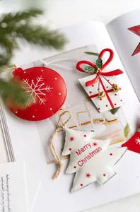 Close-up of Nordic iron Christmas ornaments with red bells and snowflake motifs