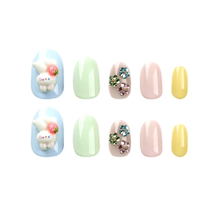 Pastel Easter press-on nails featuring 3D rabbits, floral rhinestones, and macaron colors