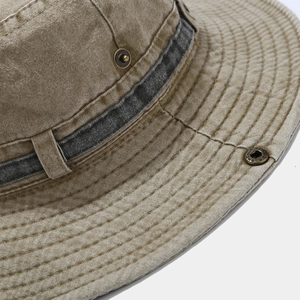 Close-up of khaki washed canvas hat with metal eyelets and reinforced stitching