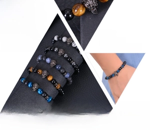 Macro detail of natural 8mm blue tiger eye beads and micro-set zircon wolf head bracelet