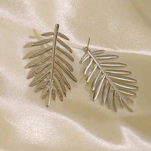 Silver leaf shaped stainless steel stud earrings with detailed palm leaf textures