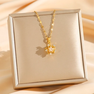 Elegant gold titanium rotatable star necklace with zircon stone on velvet box