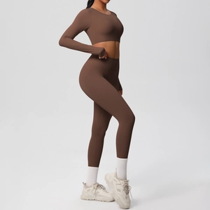 Detail view of brown seamless long sleeve yoga set with high waisted leggings on model