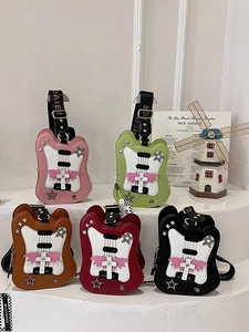 Guitar shaped crossbody bags in five colors with star studs and decorative wings