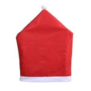 Red non-woven Christmas hat chair cover with white pom-pom on white background