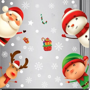 Stickers de Noël avec Père Noël et élan sur une surface de réfrigérateur en métal