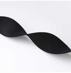 Detailed close-up of a black woven elastic waist belt with textured finish and high stretch
