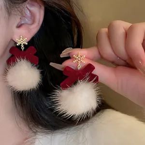 Christmas bow earrings with gold snowflake and white fur ball for winter style