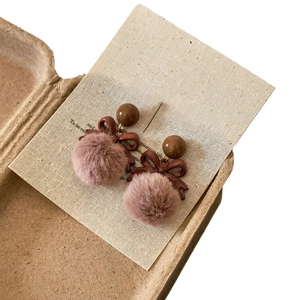 Vintage brown bow and plush ball earrings for autumn and winter in a creative box