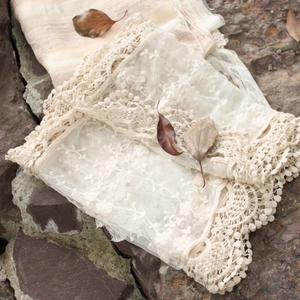 Japanese style forest beige lace embroidered long scarf on mossy stones with dry leaves