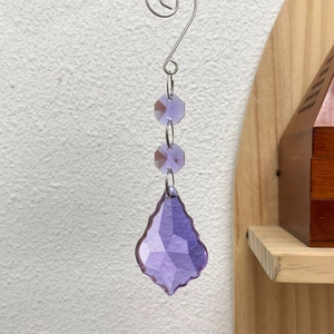 Detailed close-up of purple maple leaf crystal suncatcher with faceted glass beads