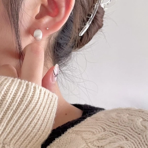 Minimalist 925 sterling silver oval stud earrings for women with a brushed metal finish