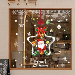 Cozy Christmas window stickers with Santa and snowflakes on a cafe glass storefront