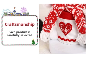 Detail of red and white knitted Christmas gift box with heart patch and fringe scarf