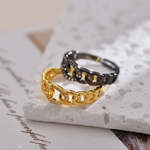 Adjustable gold and gunmetal chain ring set with sparkling cubic zirconia inlay