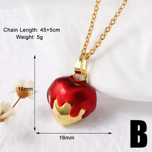 Macro shot of gold-plated red heart necklace with 45+5cm chain length and size details