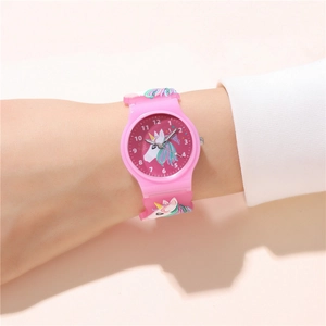 Close-up of pink children's watch featuring a colorful unicorn silicone strap and dial