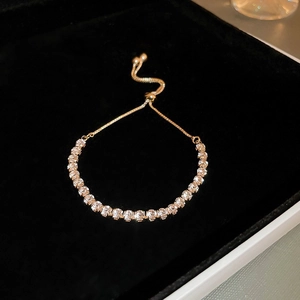 Elegant gold-plated tennis bracelet with cubic zirconia and adjustable slide closure