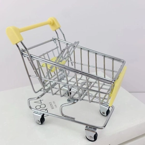 Close-up of mini metal shopping cart toy with silver wire mesh and yellow handle