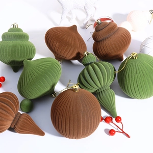 Green and brown flocked gourd-shaped Christmas balls set on a clean white background