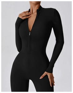 Close-up of black long sleeve yoga bodysuit with front zipper and high elastic fabric