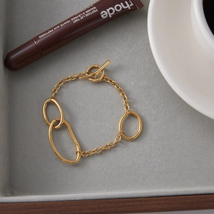 Minimalist 18K gold stainless steel chain bracelet with OT toggle and oval ring charms
