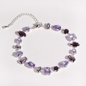 Elegant multi-shape purple zircon bracelet with silver chain on a white background