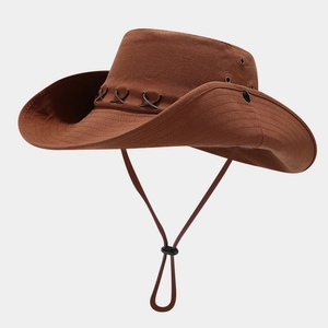 Detail view of brown western cowboy hat with leather cross stitching and metal eyelets