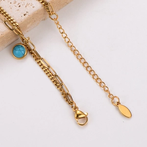 Gold-plated stainless steel double-layered chain bracelet with a round turquoise pendant
