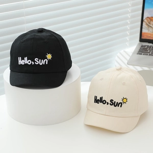 Detail of embroidered Hello Sun text and sun icon on cotton baby baseball caps