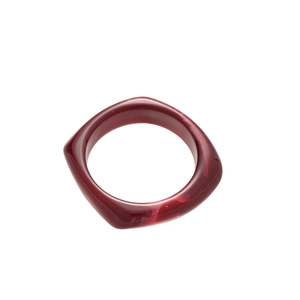 Fashionable dark red acrylic resin geometric bangle with faceted design on white background