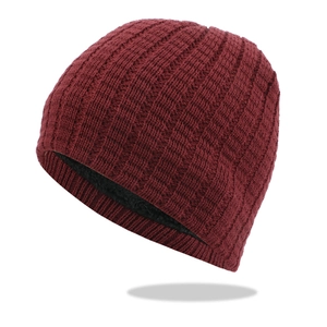 Burgundy knitted beanie with thick black fleece lining for winter warmth on white background