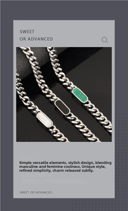 Detailed macro view of Cuban link chains with white, black, and green stone inlays