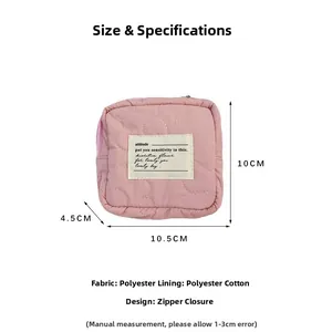 Pink quilted mini cosmetic bag featuring a secure zipper closure and soft lining details