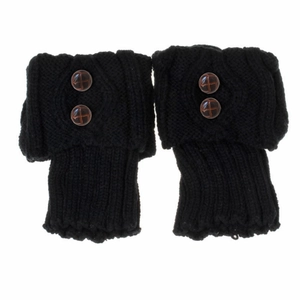 Detail of black knit leg warmers with textured buttons and diamond pattern weave
