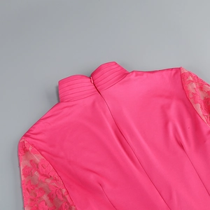 Detailed view of magenta lace cuffs and pleated high collar with invisible back zipper