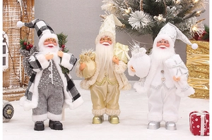 Trois figurines de Père Noël de 30 cm debout en tenues de fête grises, dorées et blanches