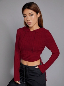 Close-up of wine red slim fit cropped hoodie with elastic ribbed knit texture