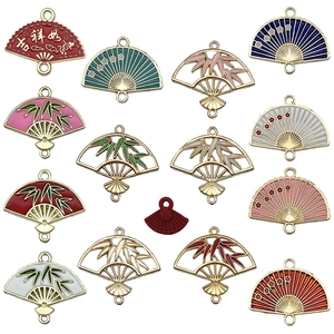 Assorted colorful enamel fan-shaped metal charms with bamboo and floral patterns