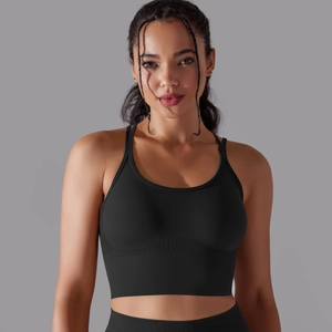 Detail of black seamless sports bra featuring a wide ribbed underband for extra support