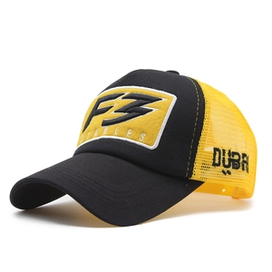 Detail of black and yellow trucker hat with F3 Stables embroidery and breathable mesh side