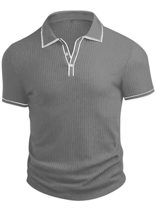 Close-up of charcoal grey men's polo shirt featuring ribbed texture and white trim details