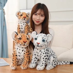 Close-up of leopard and snow leopard plush skins with soft fur and realistic details