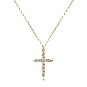 Macro shot of 18K gold rotating crown cross pendant with sparkling white cubic zirconia