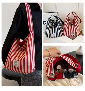 Spacious striped canvas tote bag showing interior storage for iPad and daily essentials