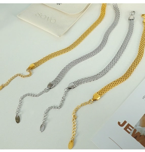 Detailed view of woven flat mesh necklaces in gold and silver with lobster clasps